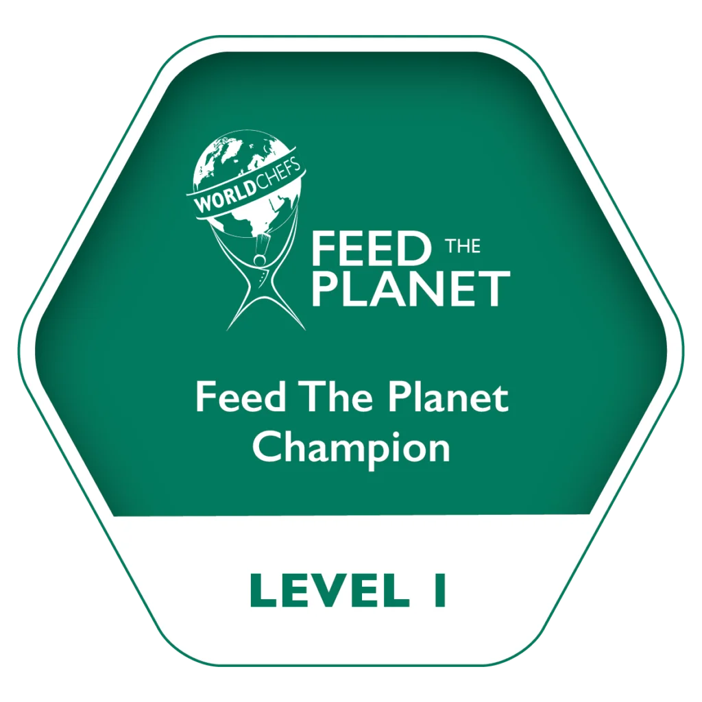 alt="Feed the planet Champion Level 1 Badge"